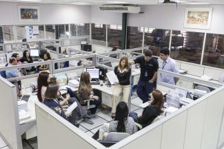 Photo of a group of women in a office cubicle